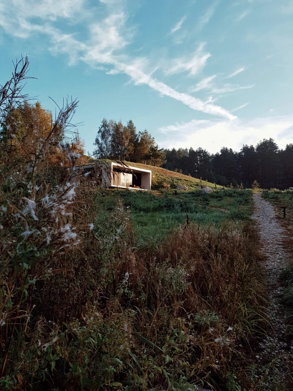 A cabin on the hill in autumn morning light