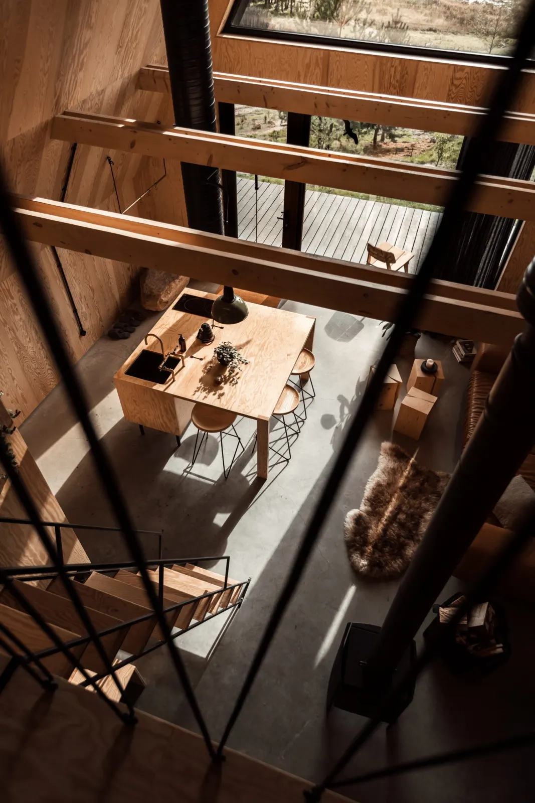 Looking down into the open living room from the mezzanine